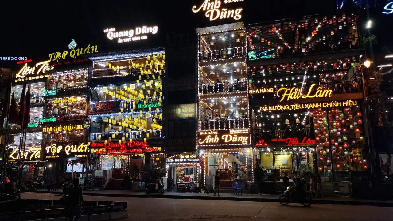 SaPa town centre lit up at night, lined with Vietnamese restaurants, Vietnam DMC by Fiesta Asia Travel